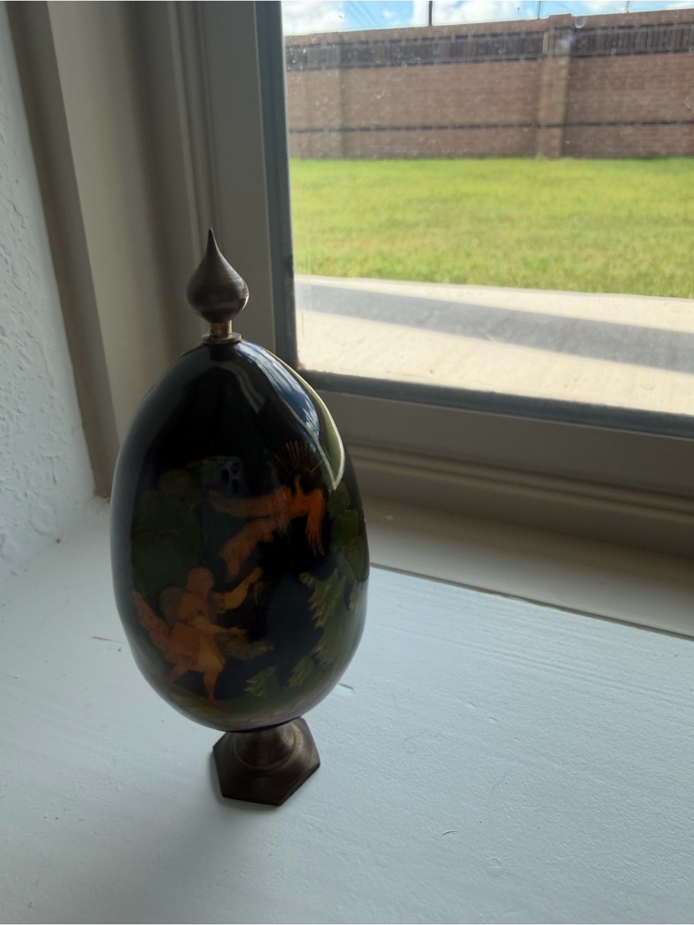 Decorative Hand-Painted Black Egg Sculpture with Bronze Stand
